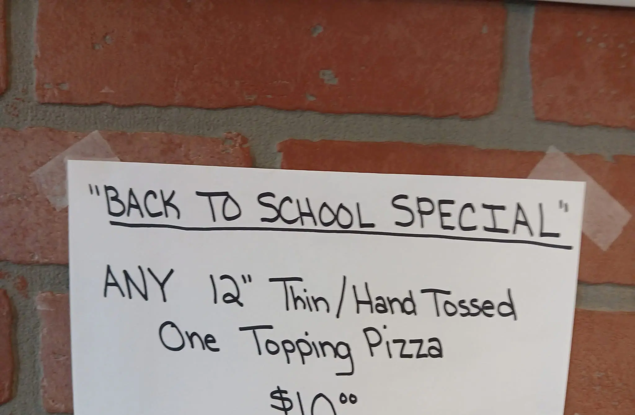 Amazing Grace Back-to-School Special board featuring a 12-inch one-topping pizza