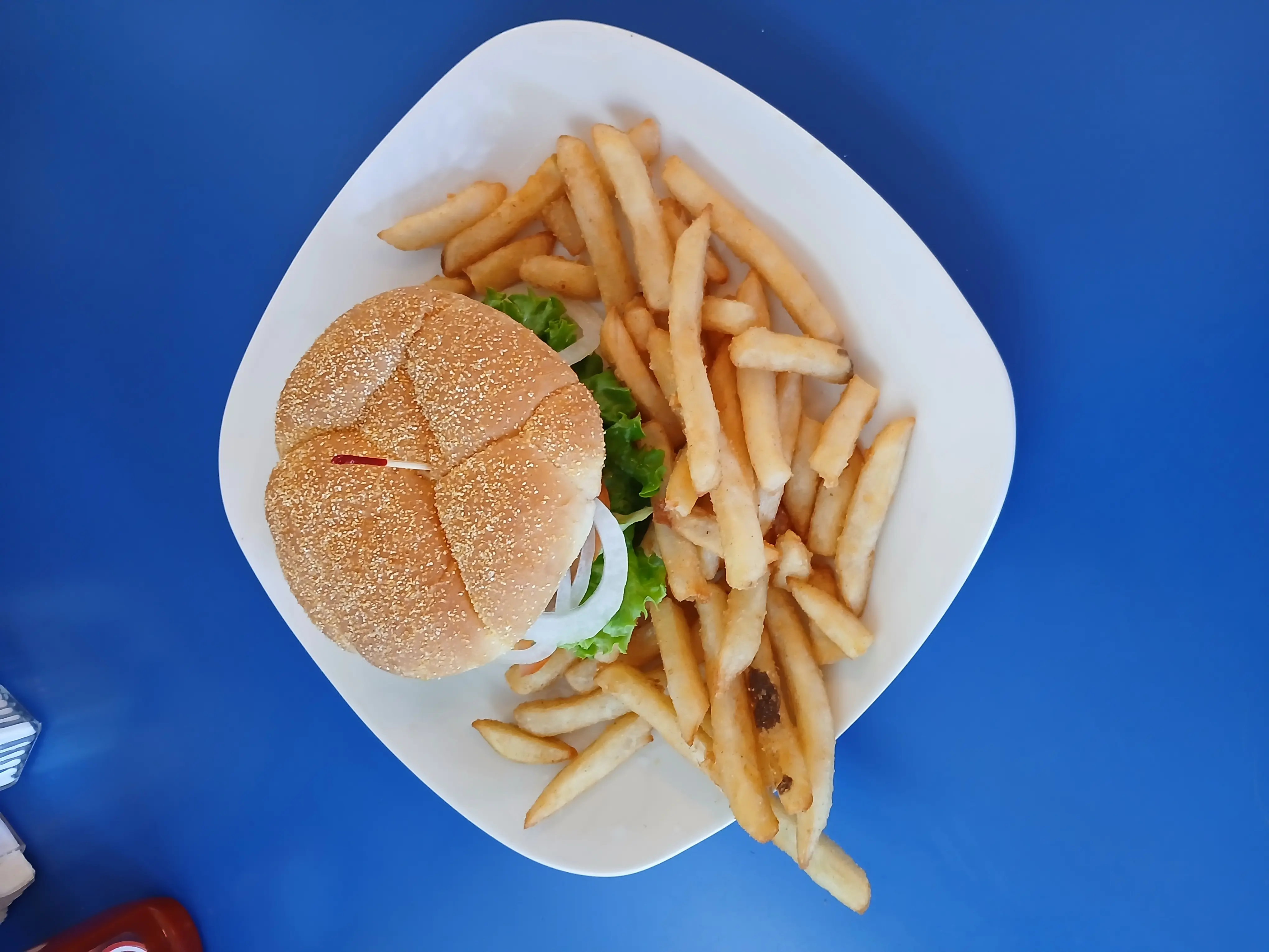 Picture of the double bacon cheeseburger on a blue table